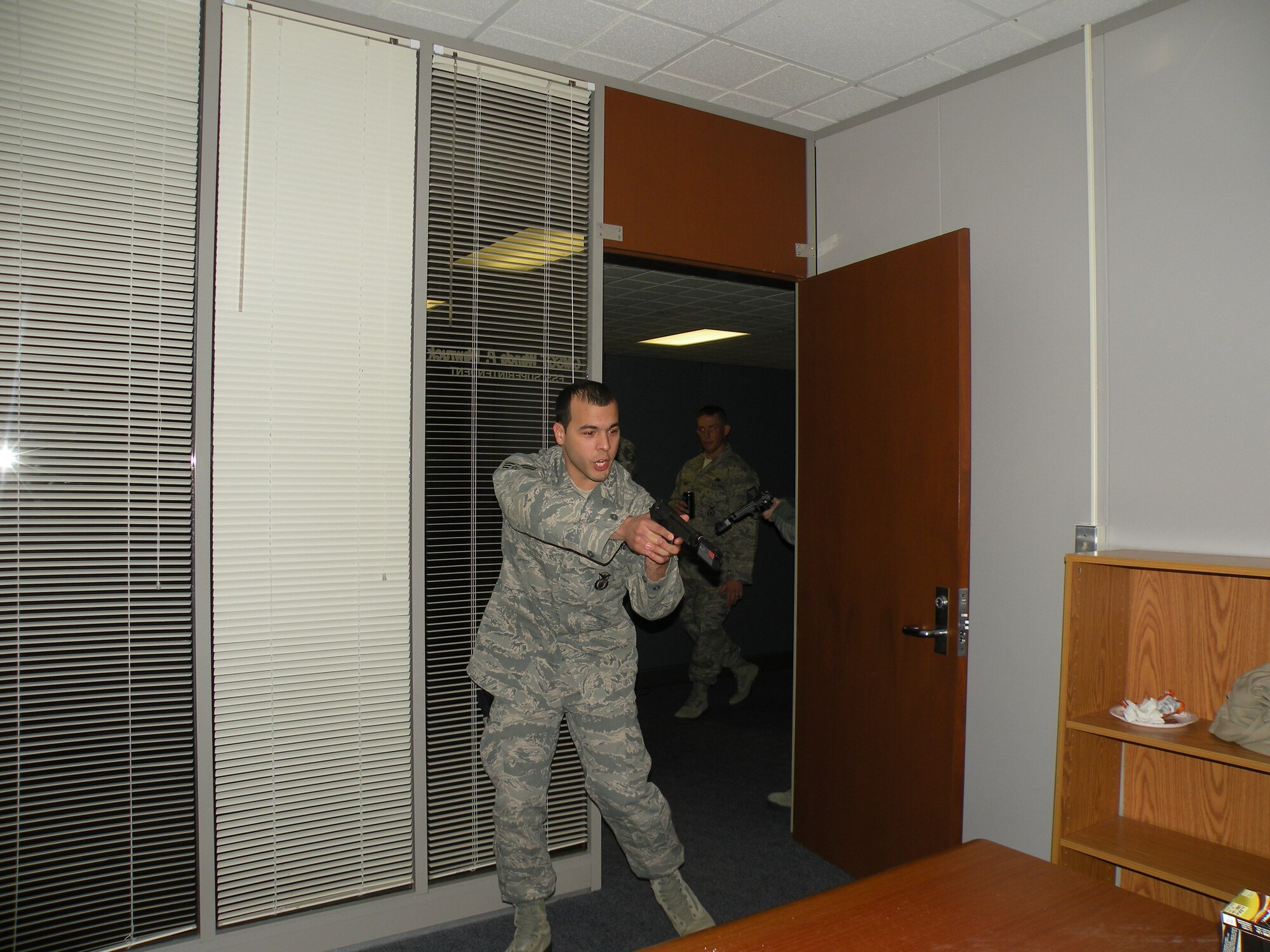 Airman 1st Class Matthew Rosado, 103rd Security Forces Squadron, confronts a hostile person as part of a training exercise at Bradley Air National Guard Base, East Granby, Conn. in 2013. (Photos courtesy of Tech. Sgt. Jessica Roy)