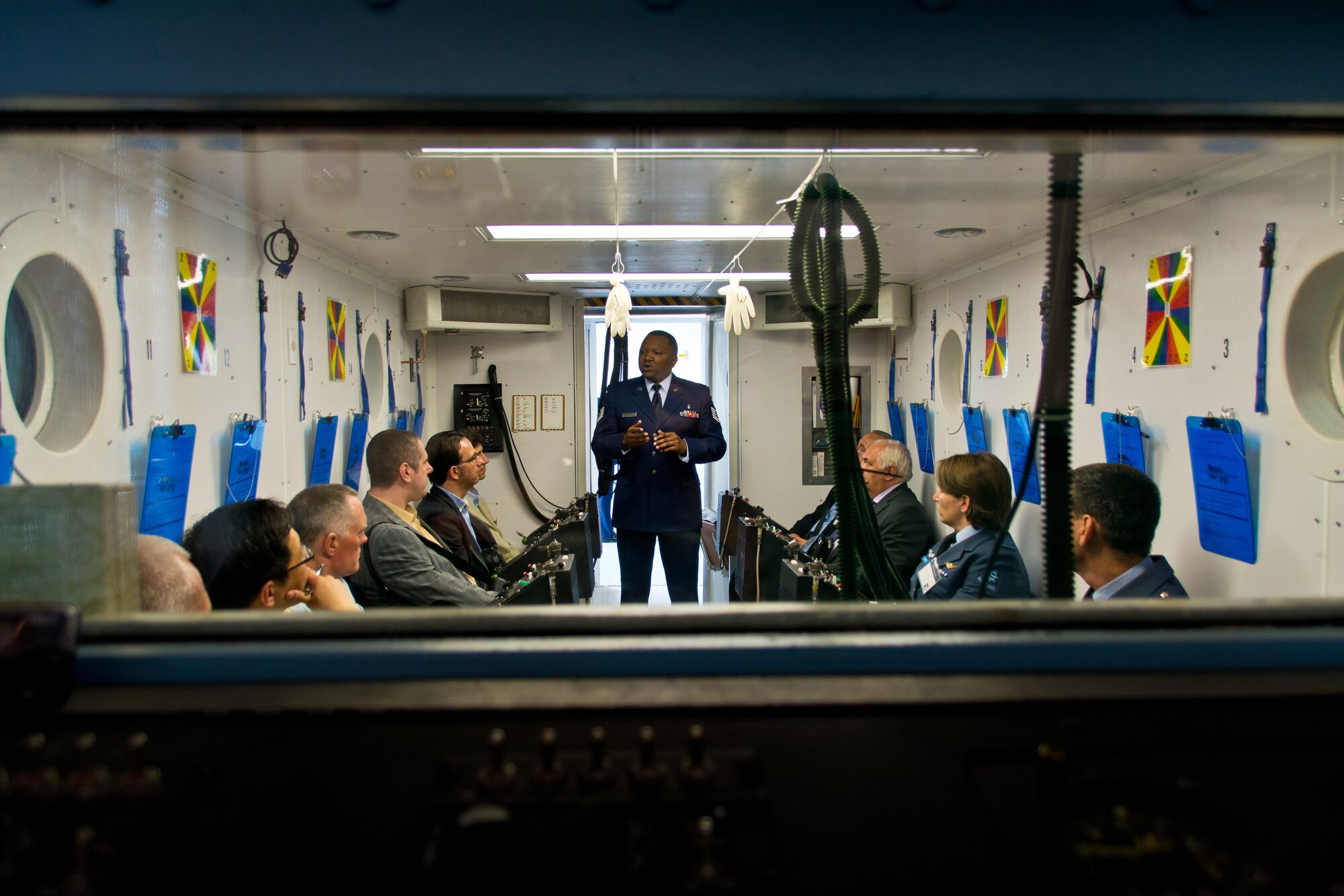 TSgt Keith Ravenel gives a presentation to Human Performance Summit attendees in the training altitude chambers.  Photo credit: Mr. Rick Eldridge