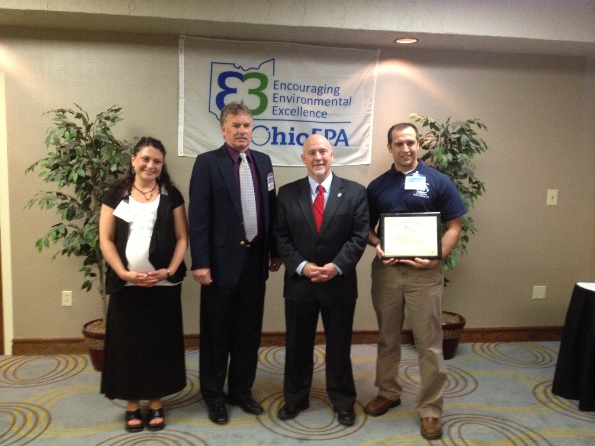 Wright-Patterson AFB receives Encouraging Environmental Excellence award from Ohio Environmental Protection Agency.  From left to right:
Christina Powell, WPAFB Design Review/EMS/ECAMP manager; Mark Mays, WPAFB Installation Management Division chief; Ohio EPA director Scott Nally; and Mike Vaughn, WPAFB Hazardous Materials manager.