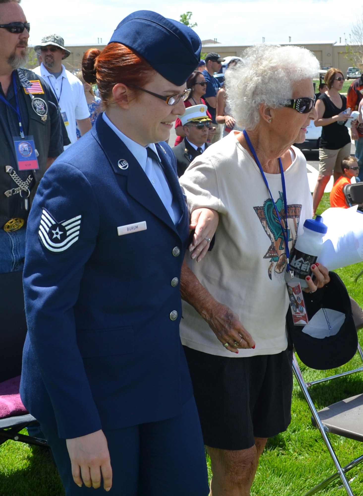 Tech Sgt. Amy Burum escorts family members or visiting dignitaries to their seats at the Colorado Freedom Memorial dedication in Aurora, Colo., near Buckley AFB, May 26. (U.S. Air Force photo/Lt. Col. Belinda Petersen) 