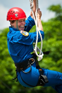 Astronaut Peggy Whitson, from the NASA Johnson Space Center in Houston, Texas, navigates the ropes course confidence at Maxwell's Officer Training School training grounds May 23, 2013. Whitson was leading a team of six U.S. and international astronauts through leadership and teamwork training obstacle courses here to evaluate the potential for future use. (U.S. Air Force photo by Donna Burnett)