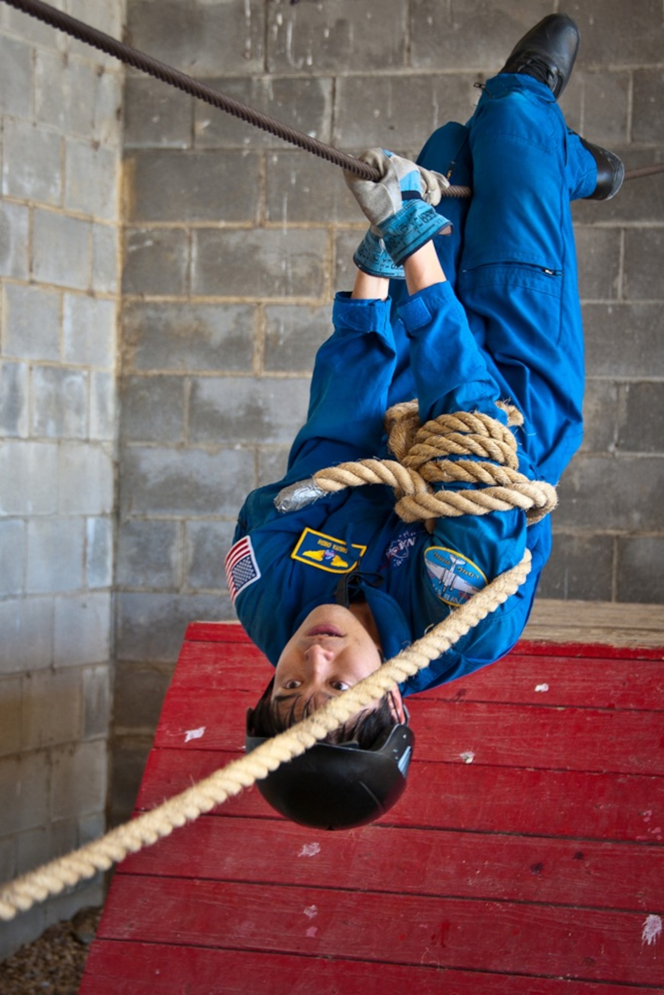 Astronaut Takuya Onishi from the Japanese Aerospace Exploration Agency navigates
the Air University Leadership Reaction Course here May 23, 2013. The LRC is a series of obstacles designed to develop leadership and teamwork skills. A team of six U.S. and international astronauts were evaluating the courses for potential further astronaut leadership training. (U.S. Air Force photo by Donna Burnett)