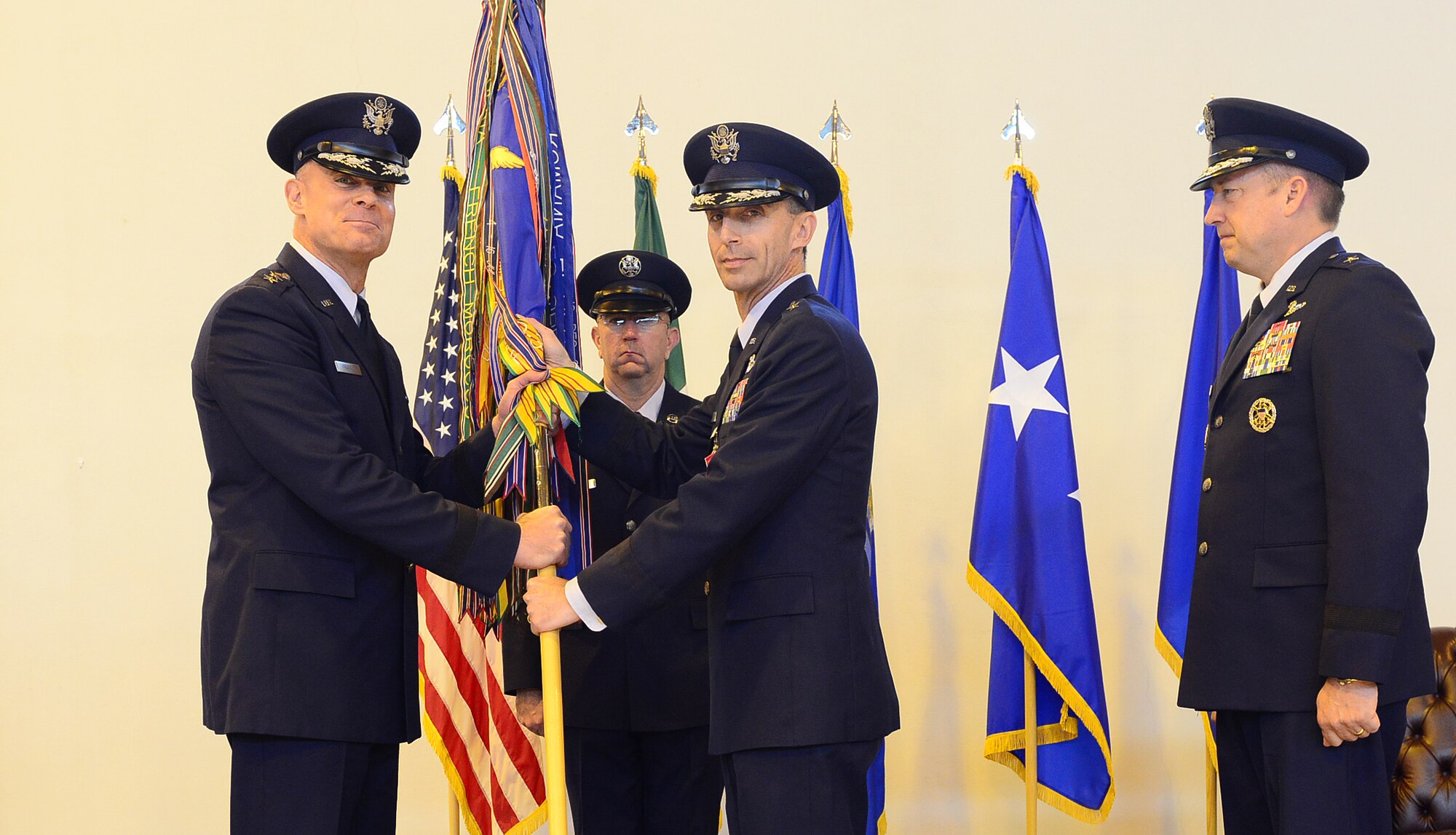 Brig. Gen. Scott Zobrist passes the 31st Fighter Wing guidon to Lt. Gen. Craig Franklin, 3rd Air Force commander, to relinquish command of the 31st FW during a ceremony May 30, 2013, at Aviano Air Base, Italy. Zobrist will now serve as the director of requirements for Headquarters Air Combat Command at Joint Base Langley–Eustis, Va. (U.S. Air Force photo/Airman 1st Class Matthew Lotz)