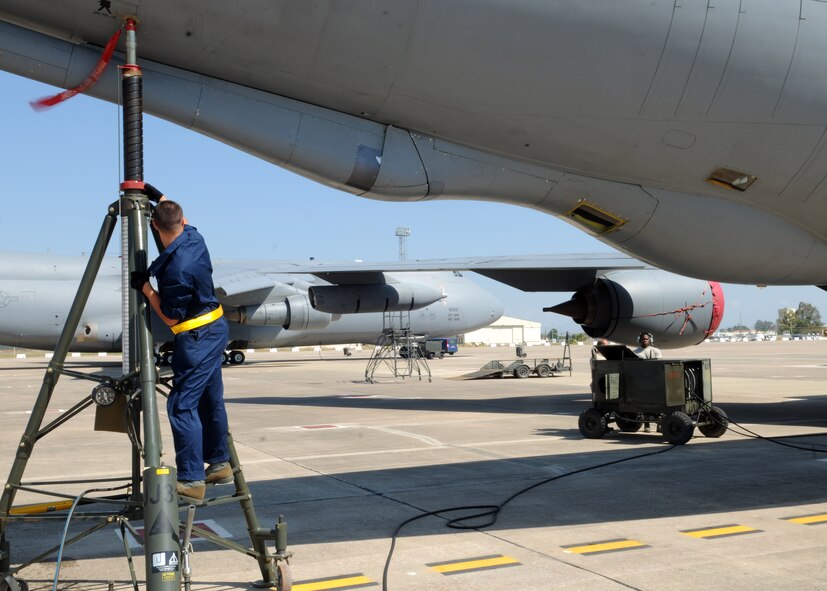 Airmen with the 351st Expeditionary Air Refueling Squadron use hydraulic jacks to elevate a KC-135R Stratotanker May 24, 2013, at Moron Air Base, Spain, to perform maintenance on the aircraft’s right main-landing gear. The Stratotanker’s strut, on the gear, was repacked to prevent hydraulic fluid inside the gear from leaking, preventing a potentially ineffective landing gear. (U.S. Air Force photo by 1st Lt. Christopher Mesnard/Released)
