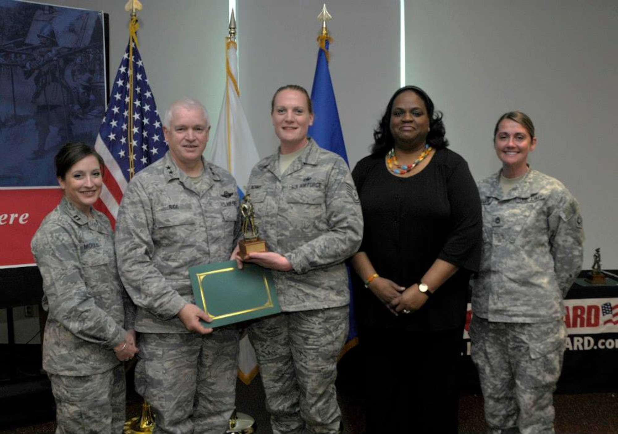 From left, Capt. Kristen Moulis; Maj. Gen. L. Scott Rice, The Adjutant General, Massachusetts National Guard; Tech. Sgt. Victoria Kenny; Executive Secretary of Public Safety, Andrea J. Cabral, Esq.; and Sgt 1st Class Nicole McNamara pose for a picture during the Massachusetts Federal Women’s Program luncheon at the Massachusetts National Guard headquarters here May 16, 2013. Kenny received the 2013 Massachusetts Air National Guard’s Woman of the Year award. (U.S. Army National Guard photo by Sgt. 1st Class James C. Lally/Released)