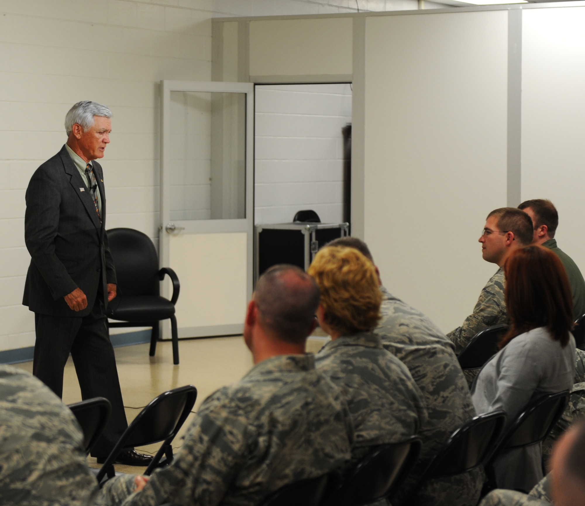Members of the 23d Medical Group listen as retired U.S. Air Force Lt. Col. Barry Bridger shares his story about being a prisoner of war during the Vietnam War during a lecture at Moody Air Force Base, Ga., May 17, 2013. Bridger spent six years imprisoned at the infamous “Hanoi Hilton” prison camp in North Vietnam. (U.S. Air Force photo by Staff Sgt. Melissa K. Mekpongsatorn/Released)