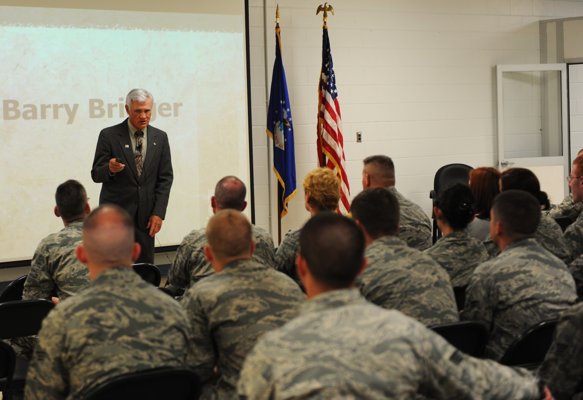 Retired U.S Air Force Lt. Col. Barry Bridger speaks to members of the 23d Medical Group about his experiences at Hanoi prison camp in North Vietnam during a lecture at Moody Air Force Base, Ga., May 17, 2013. Bridger was shot down during the Vietnam War where he was captured and imprisoned for six years. (U.S. Air Force photo by Staff Sgt. Melissa K. Mekpongsatorn/Released)