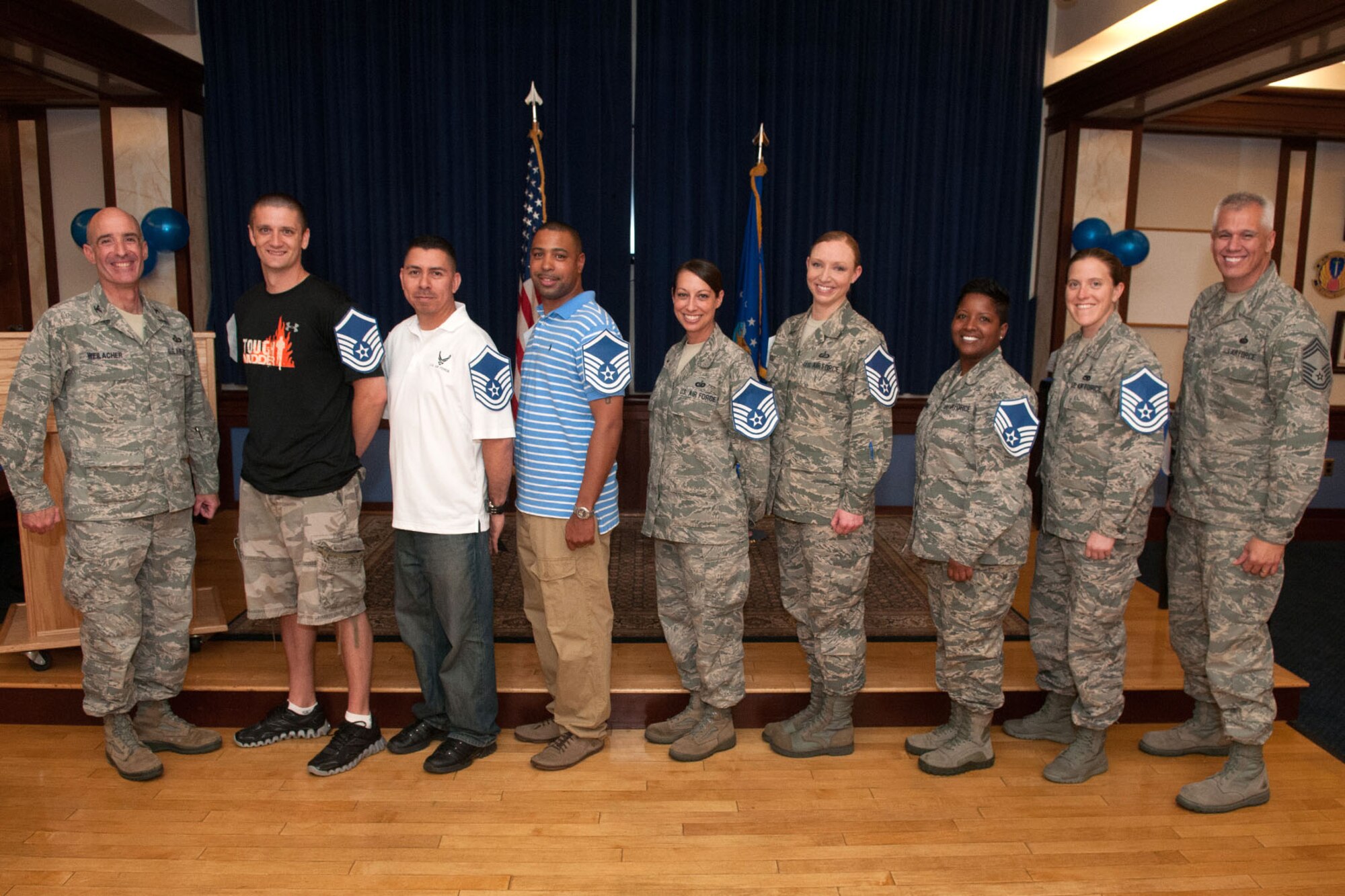 HANSCOM AIR FORCE BASE, Mass. --  Col. Lester A. Weilacher (far left), 66th Air Base Group commander, and Chief Master Sgt. Mitchell Balutski (far right), 66th Air Base Group superintendent and installation senior enlisted advisor, pose with the newest members selected to the Senior NCO ranks during the Master Sgt. release party at the Minuteman Commons May 23. (U.S. Air Force photo by Rick Berry)
