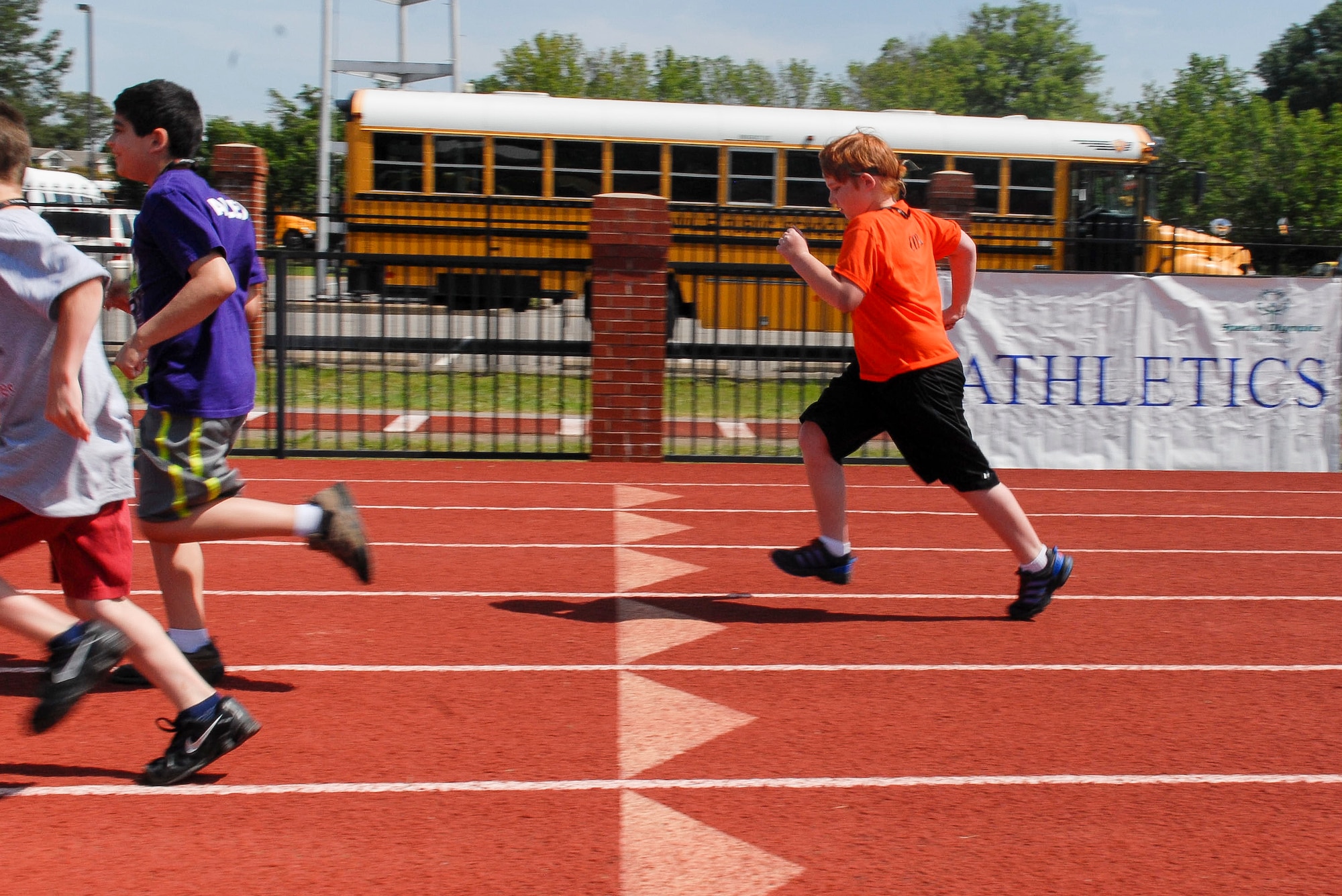 Cody Anderson, son of Tech. Sgt. Philip Anderson and Kiley Anderson, runs in the 100 meter dash May 25, 2013, at the 2013 Arkansas Summer Special Olympics May 25, 2013, at Harding University in Searcy, Ark. Anderson, diagnosed with Asperger’s syndrome, competed in two events at the Olympics. (U.S. Air Force photo by Staff Sgt. Jacob Barreiro)