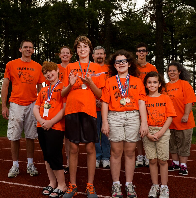 The members of Team Herc display their medals from the 2013 Arkansas Summer Special Olympics May 29, 2013, at Little Rock Air Force Base, Ark. The team and its supporters spent Memorial Day weekend competing in a variety of athletic events. (U.S. Air Force photo by Staff Sgt. Russ Scalf)