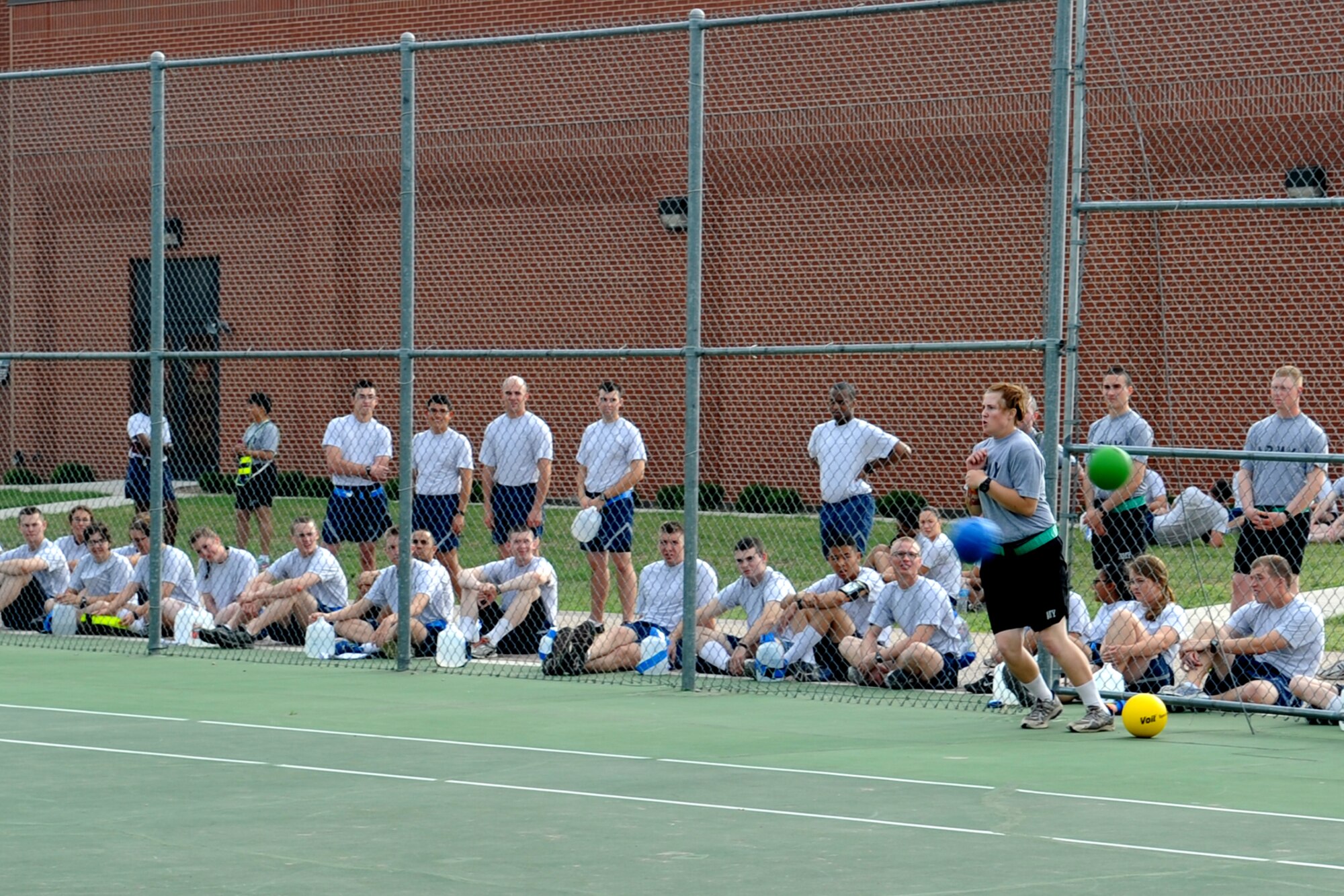 GODDFELLOW AIR FORCE BASE, Texas -- Army Pfc. Erica Stephenson, Army 344th Military Intelligence Battalion student, dodges multiple balls thrown at her from the opposing team during Sports and Safety Day, May 23. The day included a “Street Smart” safety presentation and sports, such as basketball and dodge ball. (U.S. Air Force photo/ Staff Sgt. Laura R. McFarlane)