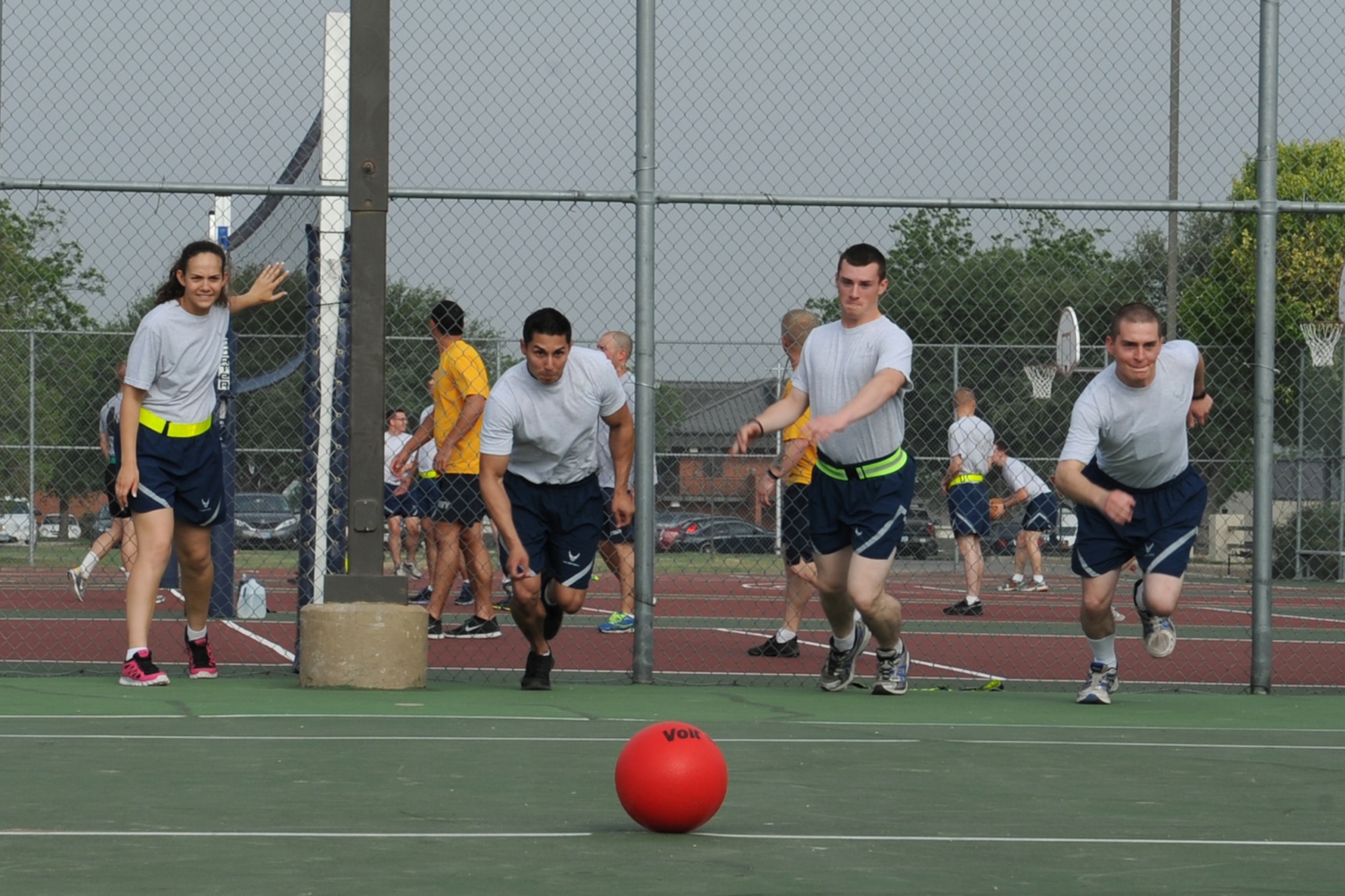 GOODFELLOW AIR FORCE BASE, Texas -- Students from the 316th Training Squadron race for a ball at the start of a dodge ball game during Sports and Safety Day, May 23. The day included a “Street Smart” safety presentation and sporting events, such as basketball and dodge ball. (U.S. Air Force photo/ Staff Sgt. Laura R. McFarlane)