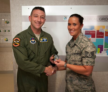 Staff Sgt. Lara Ashley, 47th Medical Operations Squadron NCO in charge of public health, receives a pair of 2nd lieutenant bars from Col. Brian Hastings, 47th Flying Training Wing commander, at Laughlin Air Force Base, Texas, May 28, 2013. The Air Force allows 16.47 percent of applicants to transition from being an enlisted member to serving as an officer. (U.S. Air Force photo/Airman 1st Class John D. Partlow)