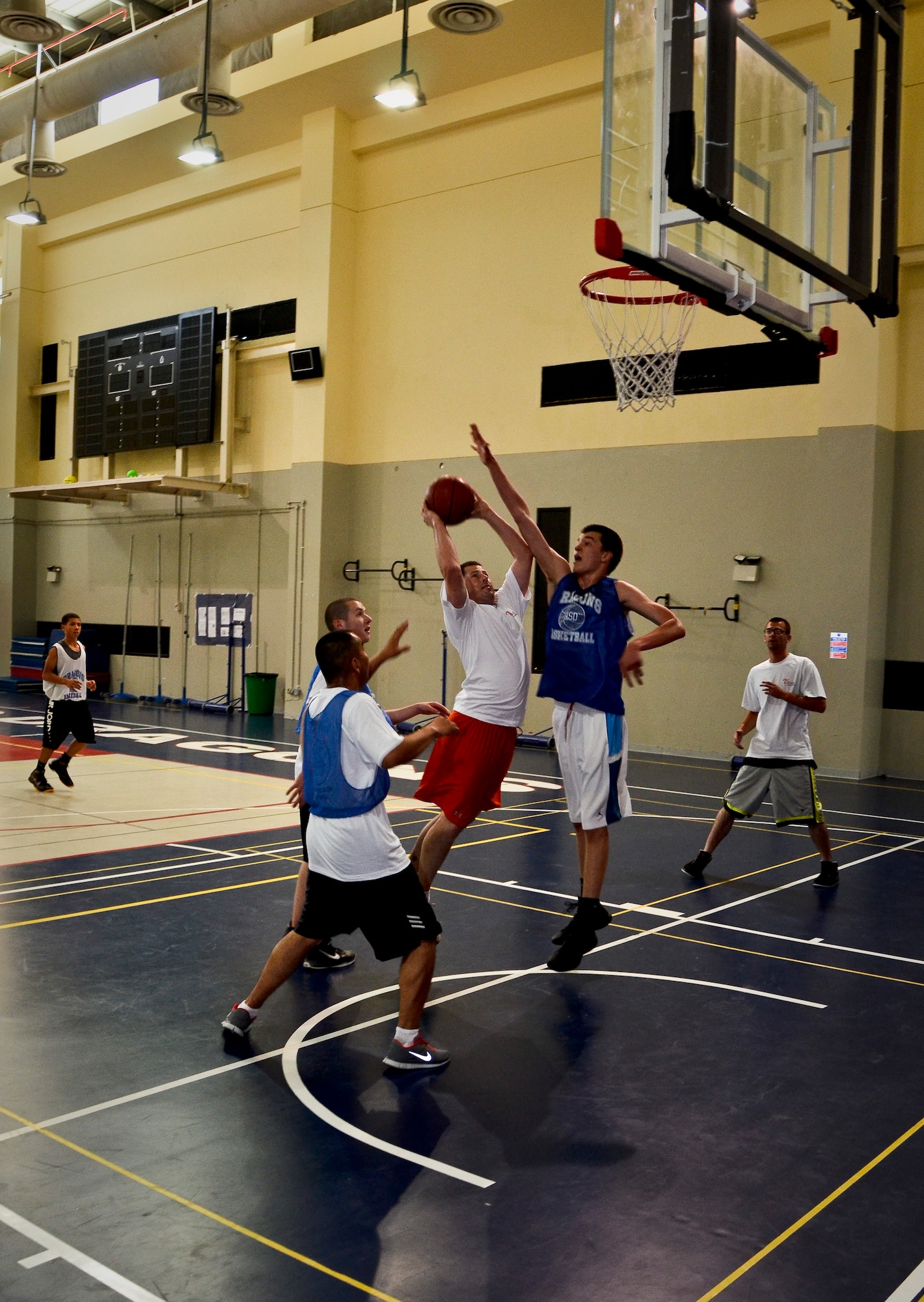 Tech. Sgt. Michael Sequin attempts a layup during a basketball game at a local school’s annual military appreciation day, May 25, 2013, in Southwest Asia. Sequin is the 763rd Expeditionary Reconnaissance Squadron electronic warfare maintenance NCO in charge and deployed from Offutt Air Force Base, Neb. (U.S. Air Force photo/Senior Airman Benjamin Stratton)