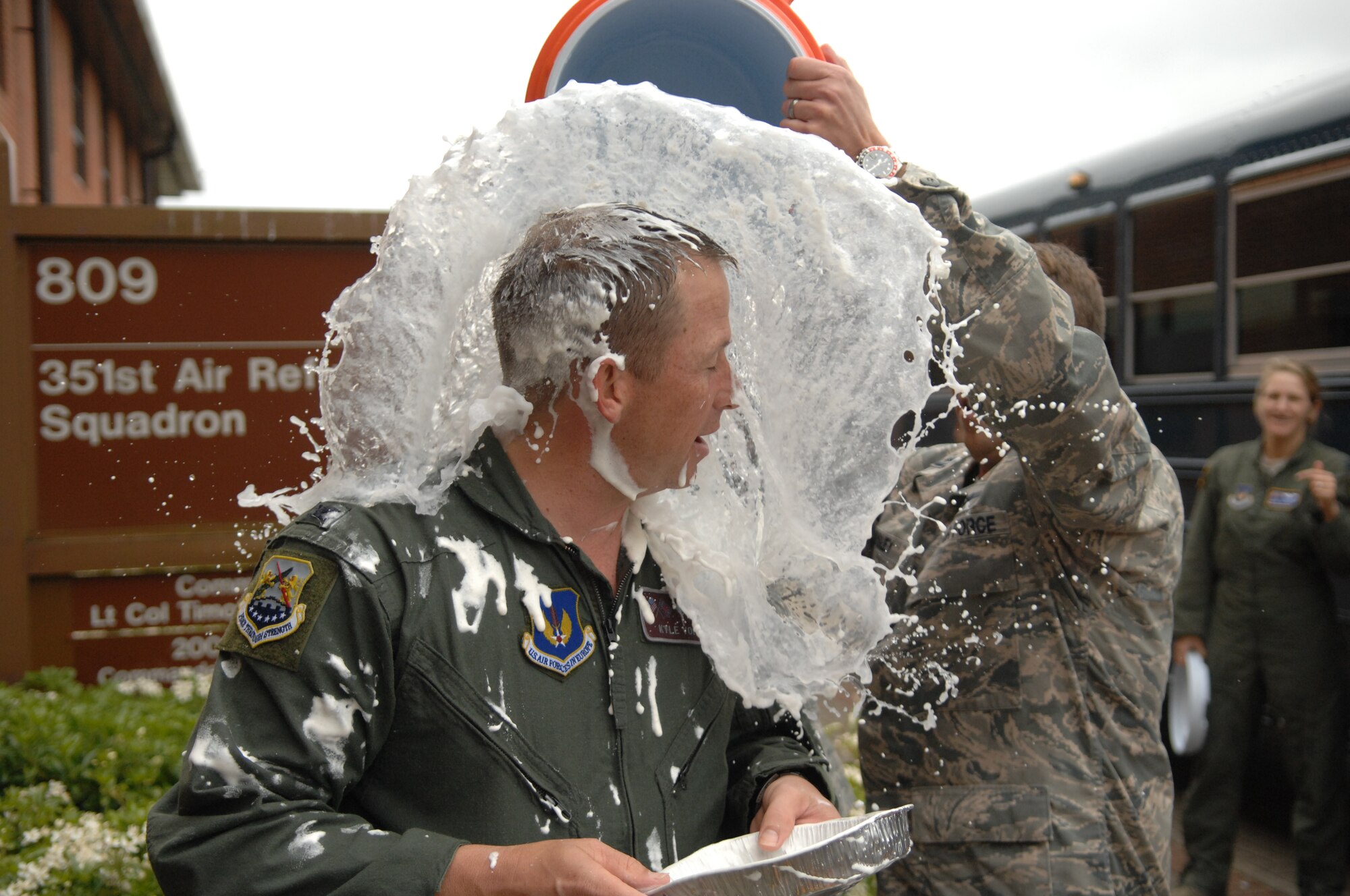 Col. Kyle Voigt, 100th Air Refueling Wing vice commander, gets drenched following his fini flight May 29, 2013, at RAF Mildenhall, England. The flight, a routine training refueling mission with the 31st Fighter Wing, commemorated Voigt’s time at RAF Mildenhall. (U.S. Air Force photo by Airman 1st Class Dillon Johnston/Released)