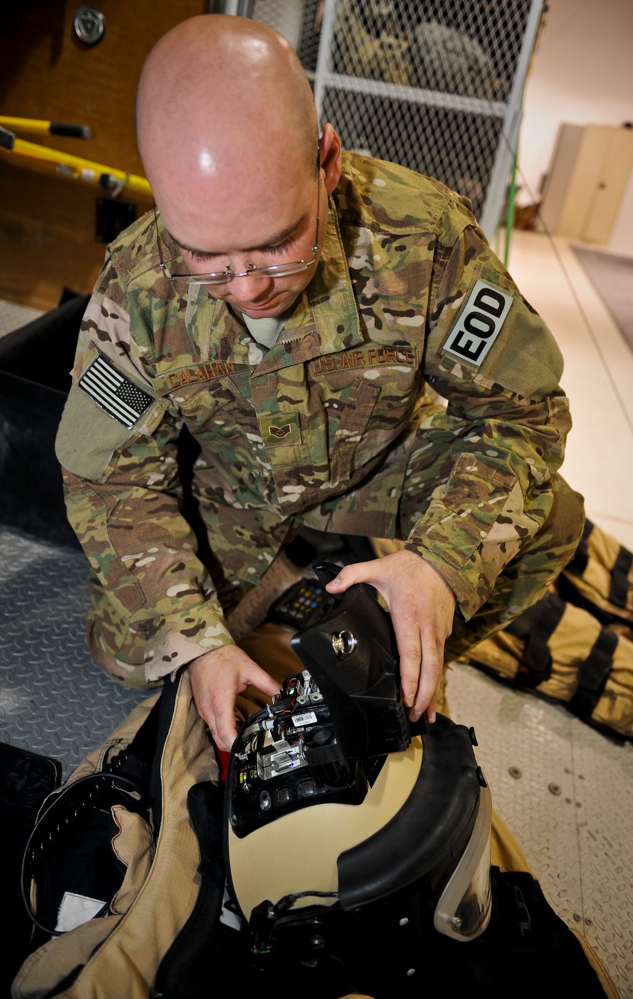 Staff Sgt. Joel Calahan inspects the battery pack of an explosive ordnance disposal bomb suit, May 29, 2013, at the 379th Air Expeditionary Wing in Southwest Asia. Calahan is a 379th Expeditionary Civil Engineer Squadron EOD craftsman deployed from Nellis Air Force Base, Nev. (U.S. Air Force photo/Senior Airman Benjamin Stratton)