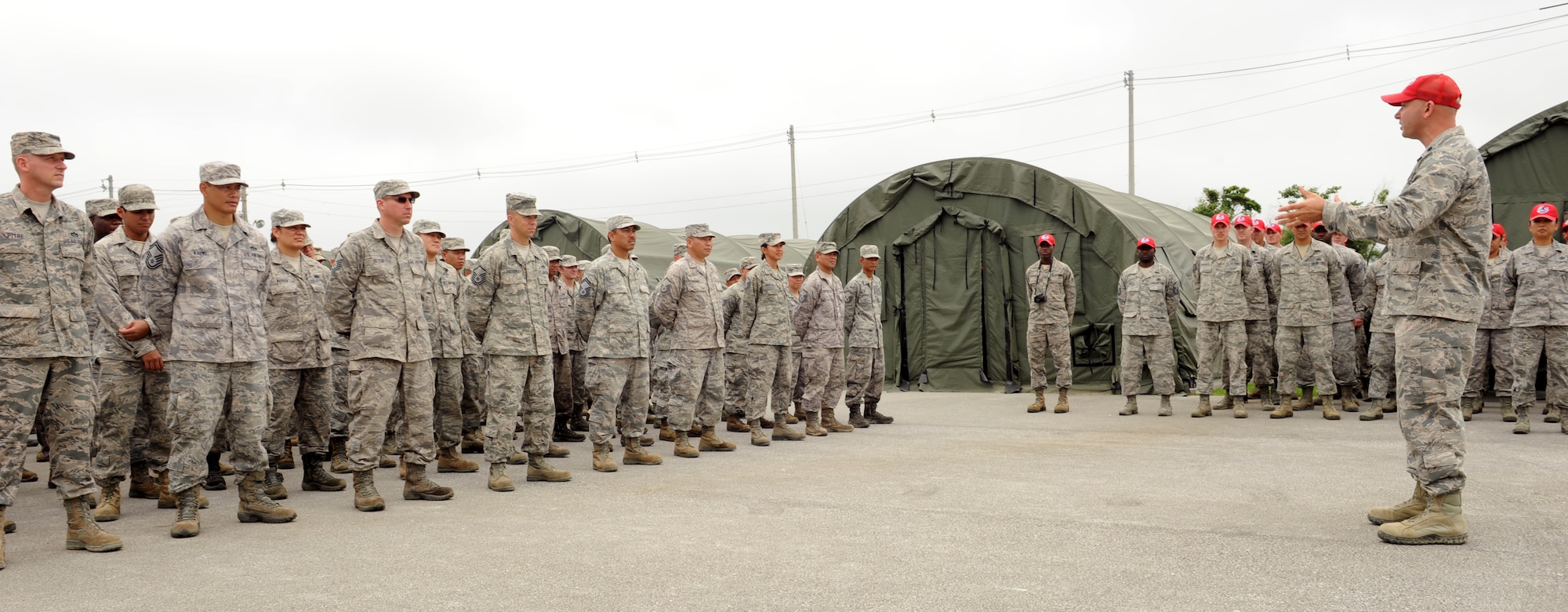 U.S. Air Force Lt. Col. Matthew Rochon, 554th RED HORSE Squadron Detachment 1 commander, addresses the detachment and final Silver Flag class on Kadena Air Base, Japan, May 22, 2013. Rochon spoke to the troops during the final ceremony before the contingency exercise training center moves to Guam, where they can better accomplish their new mission -- to build partner capacity in the Pacific region. (U.S. Air Force photo by Airman 1st Class Keith A. James/Released)