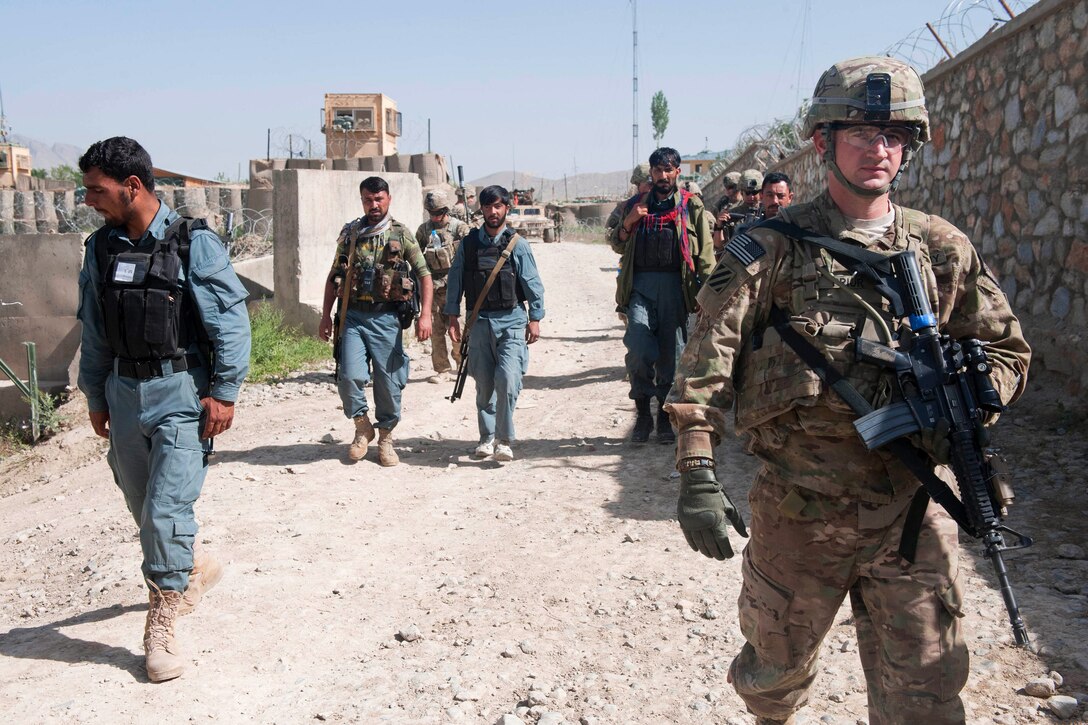 U.S. Army 1st Lt. Joshua Prior, right, Afghan local police and Afghan soldiers conduct a presence patrol and resupply mission near Combat Outpost Baraki Barak in Afghanistan’s Logar province, May 22, 2013. Prior is assigned to the 3rd Infantry Division's 6th Squadron, 8th Cavalry Regiment, 4th Infantry Brigade Combat Team.
