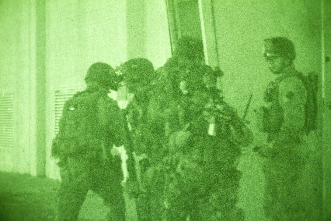 Marines and Sailors with the Force Reconnaissance Platoon, 31st Marine Expeditionary Unit, enter a warehouse filled with enemy role players during the culmination of a Close Quarters Tactics course here, May 24. The CQT course, run by Special Operations Training Group, III Marine Expeditionary Force, involved engaging the enemy at very short ranges in a fast, violent assault requiring precision fire and split-second decision making. With the certification completed, the platoon stands ready to conduct any mission the 31st MEU may deem necessary during their upcoming patrol. The 31st MEU is the only continuously forward-deployed MEU and is the Marine Corps’ force in readiness in the Asia-Pacific region. 