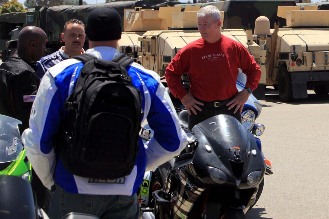 Lt. Gen. John A. Toolan, commanding general of I Marine Expeditionary Force, speaks with members of the I MEF/ I Marine Expeditionary Force Headquarters Group Motorcycle Club before a group ride at Camp Pendleton, May 30. The Marines began their ride at Camp Pendleton and rode approximately 25 miles around the southern portion of base. The purpose of the ride was to build camaraderie within the unit and educate the riders on basic motorcycle maintenance, and safety.