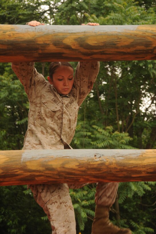 Lance Cpl. Cassie Engle climbs the Stairway to Heaven, an obstacle of the Confidence Course aboard Marine Corps Base Quantico, on May 22, 2013. Headquarters Company, Headquarters and Service Battalion, used the course for a company physical training exercise.