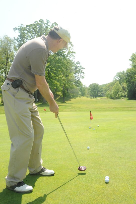 Mitch Hailstone, retired airman, takes practice putts at the Medal of Honor Golf Course aboard Marine Corps Base Quantico on May 10, 2013. Each of the 18 holes at the course is dedicated to a Medal of Honor recipient.