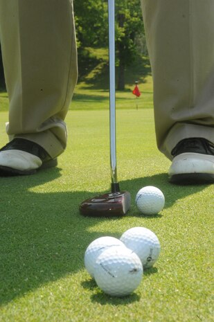 Mitch Hailstone, retired airman, lines up a putt at the Medal of Honor Golf Course aboard Marine Corps Base Quantico on May 10, 2013. Golf experts suggest practicing between 30 minutes - one hour  a couple times a week in addition to playing several times a week for golfers to see definite improvement.