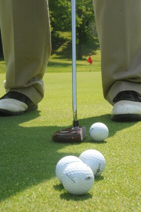 Mitch Hailstone, retired airman, lines up a putt at the Medal of Honor Golf Course aboard Marine Corps Base Quantico on May 10, 2013. Golf experts suggest practicing between 30 minutes - one hour  a couple times a week in addition to playing several times a week for golfers to see definite improvement.