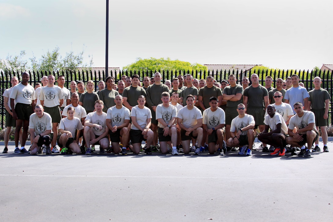 Volunteer’s from Law Enforcement Battalion and Security Battalion here gathered for a group photograph before running 17 miles across Camp Pendleton with the Special Olympics torch in support of the 2013 summer games here May 29.