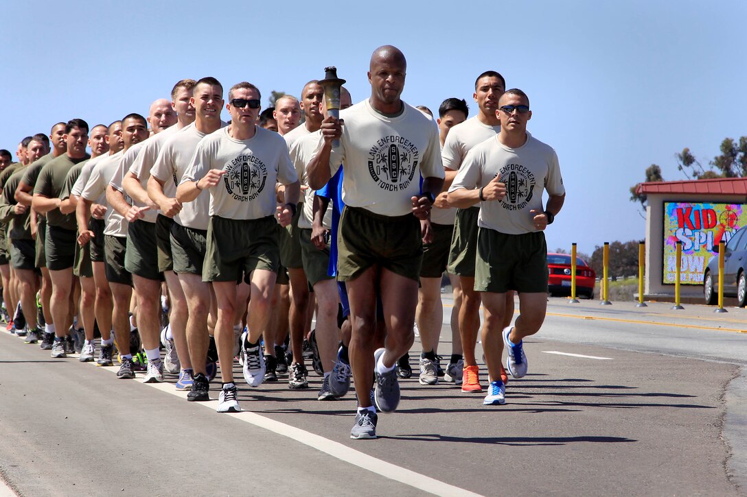Volunteer’s from Law Enforcement Battalion and Security Battalion here ran 17 miles across Camp Pendleton with the Special Olympics torch in support of the 2013 summer games here May 29.