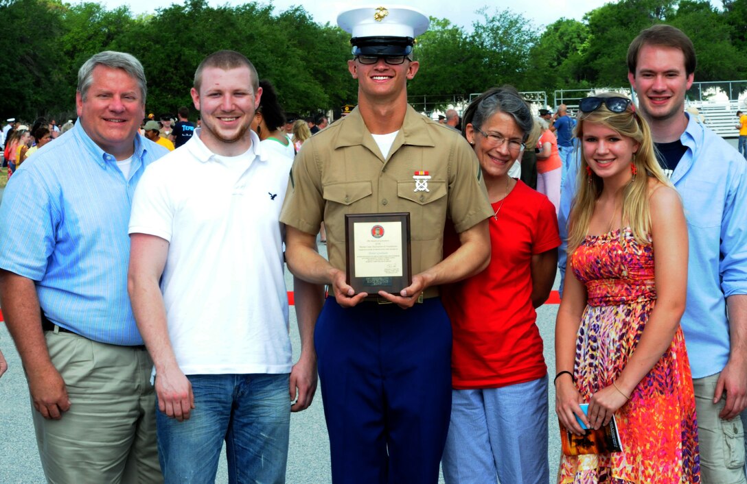 Private First Class Joseph W. Skinner, honor graduate of platoon 2045, stands with his family after graduation aboard Parris Island, S.C., May 31, 2013. Skinner is a native of Memphis, Tenn., and was recruited from Recruting Sub-Station Memphis, Recruting Station Nashville by his recruiter, Staff Sgt. Darnell S. Ham. Skinner will be able to enjoy some much deserved leave as he prepares for Marine Combat Training at Camp Geiger, N.C. (U.S. Marine Corps photo by Pfc. Stanley Cao)