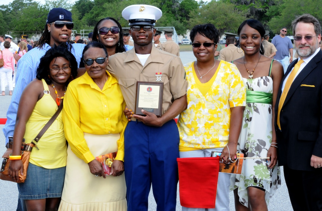 Private First Class Justin R. Rountree, honor graduate of platoon 2046, stands with his family after graduation aboard Parris Island, S.C., May 31, 2013. Rountree is a native of Marietta, Ga., and was recruited from Recruiting Sub-Station Statesboro, Recruiting Station Jacksonville by his recruiter, Sgt. Michael J. Roennebeck. Rountree will be able to enjoy some much deserved leave as he prepares for Marine Combat Training iat Camp Geiger, N.C. (U.S. Marine Corps photo by Pfc. Stanley Cao)
