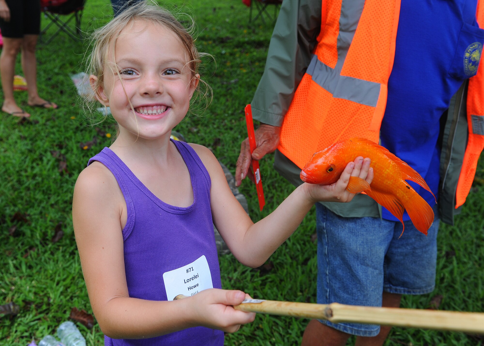 Lorelei Howe, 6, beams with pride over her catch at the annual Keiki Fishing Tournament at Ho'omaluhia Botanical Gardens in Kaneohe, Hawaii, May 29, 2013. The family-friendly event has been hosted by the Friends of Hickam for 14 years now. (U.S.  Air Force photo/Tech.  Sgt. Jerome S. Tayborn)