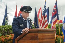 Col. Dann Carlson, departing commander, 647th Air Base Group, Joint Base Pearl Harbor-Hickam, Hawaii speaks at the 647th ABG change of command ceremony on 31 May 2013 at the Missing Man Formation on Hickam Field.  (Photo by David D.
Underwood, Jr.)
