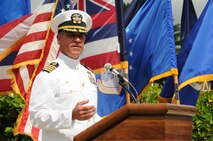 Capt. Jeffrey James, Commander, Joint Base Pearl Harbor-Hickam, Hawaii speaks during the 647th Air Base Group change of command ceremony on 31 May
2013 at the Missing Man Formation on Hickam Field.  (Photo by David D.
Underwood, Jr.)
