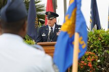 Col. Johnny Roscoe, Commander, 15th Wing, Joint Base Pearl Harbor-Hickam, Hawaii speaks during the 647th Air Base Group change of command ceremony on 31 May 2013 at the Missing Man Formation on Hickam Field.  (Photo by David D.
Underwood, Jr.)
