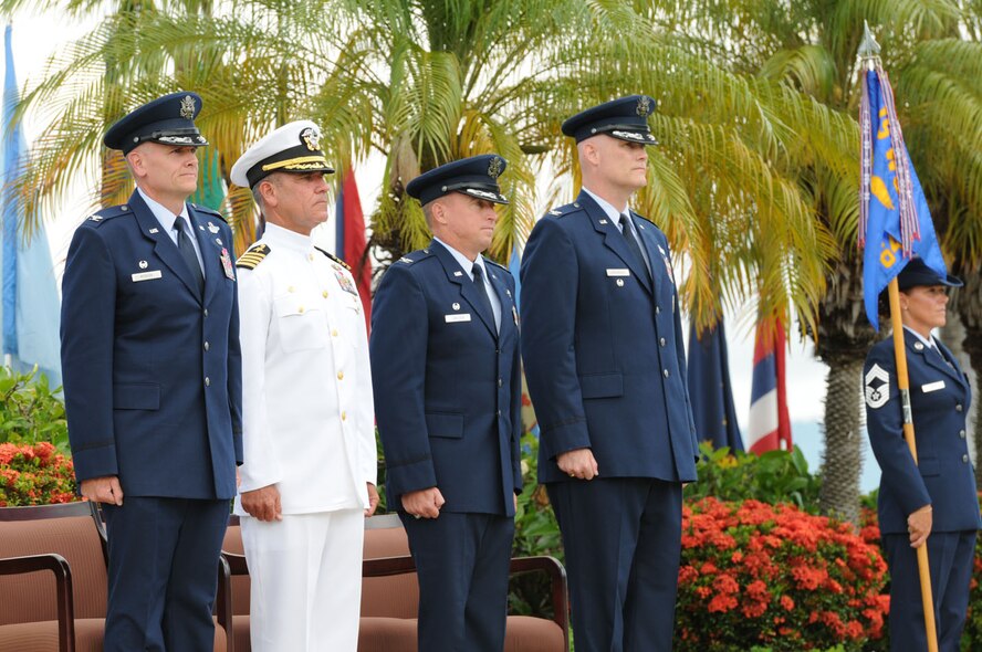 Col. Johnny Roscoe, Commander, 15th Wing, Capt Jeffrey James, Commander, Joint Base Pearl Harbor-Hickam, Col. Dann Carlson, departing Commander, 647th Air Base Group, and Col. David Kirkendall, arriving Commander, 647th ABG stand ready to begin the 647th ABG change of command ceremony on 31 May 2013 at the Missing Man Formation on Hickam Field.  (Photo by David D. Underwood, Jr.)
