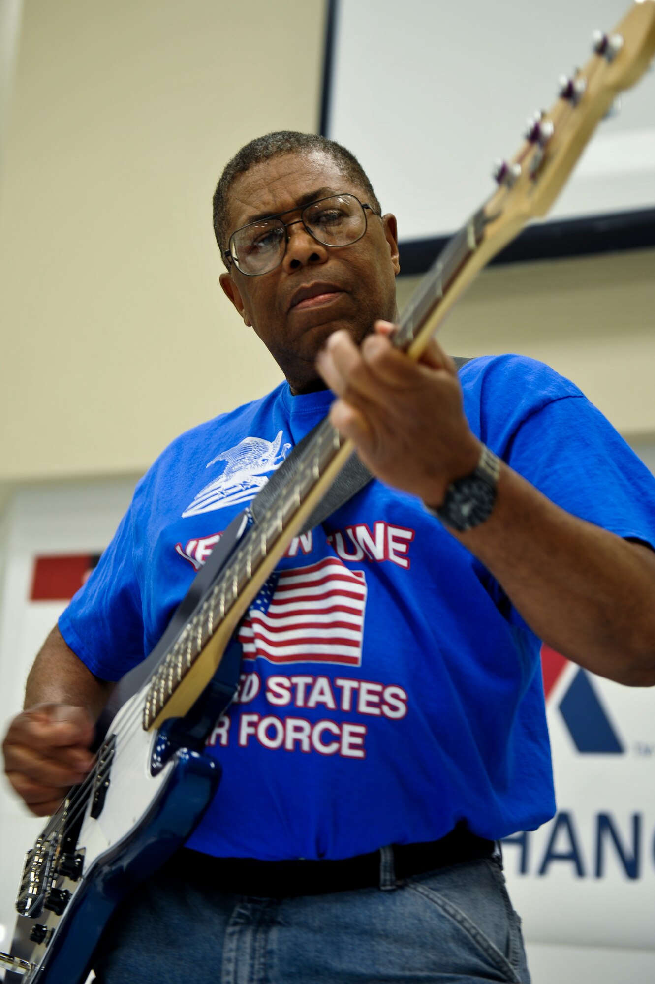 Ivan Taylor, Vets in Tune guitarist, plays the bass guitar during a performance May 17, 2013, at The Exchange on Buckley Air Force Base, Colo. Vets in Tune is a band of disabled veterans from the Denver area. The band travels the Front Range and plays an average of 40 performances a year. (U.S. Air Force photo by Airman 1st Class Riley Johnson/Released)