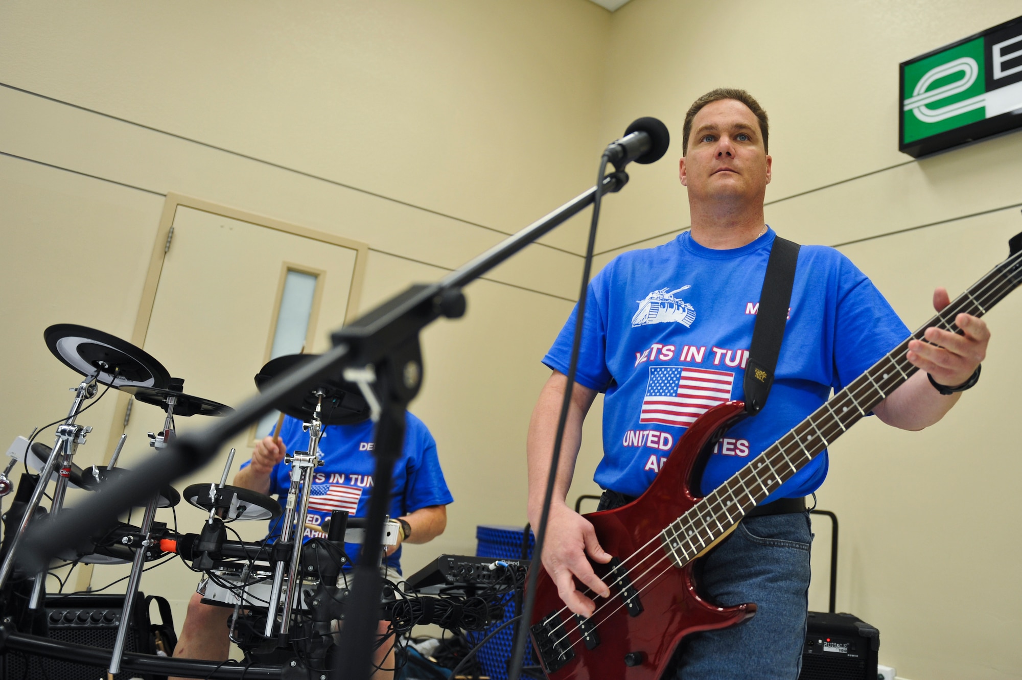 Michael Paplow, Vets in Tune bass guitarist, plays a song during a performance May 17, 2013, at The Exchange on Buckley Air Force Base, Colo. Paplow, a disabled U.S. Army veteran from the Denver area, is one of four members of the band that performs at veteran affairs clinics, nursing homes and base exchanges. (U.S. Air Force photo by Airman 1st Class Riley Johnson/Released)