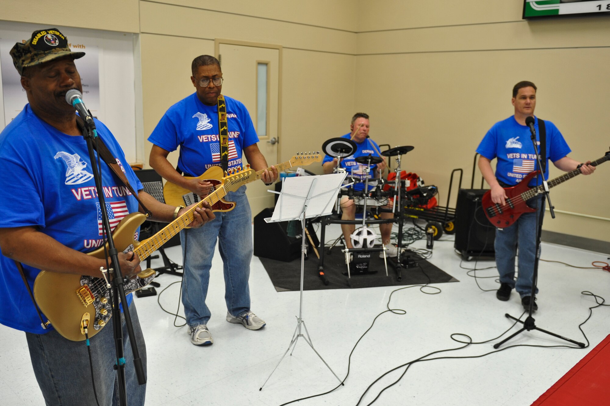 Vets in Tune play a song during a performance May 17, 2013, at The Exchange on Buckley Air Force Base, Colo. The band of veterans played a variety of songs including, blues, rhythm, rock and pop during their performance. (U.S. Air Force photo by Airman 1st Class Riley Johnson/Released)
