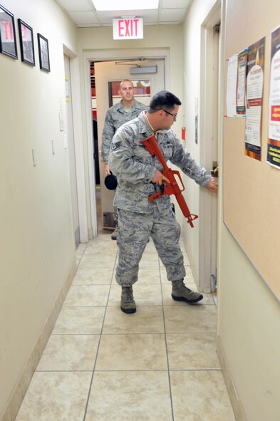 Staff Sgt. William Burke, 94th Security Forces Squadron specialist, portrays an active shooter during a recent training session at the Dobbisn Fire Department. (U.S. Air Force photo/Senior Airman Elizabeth Van Patten)