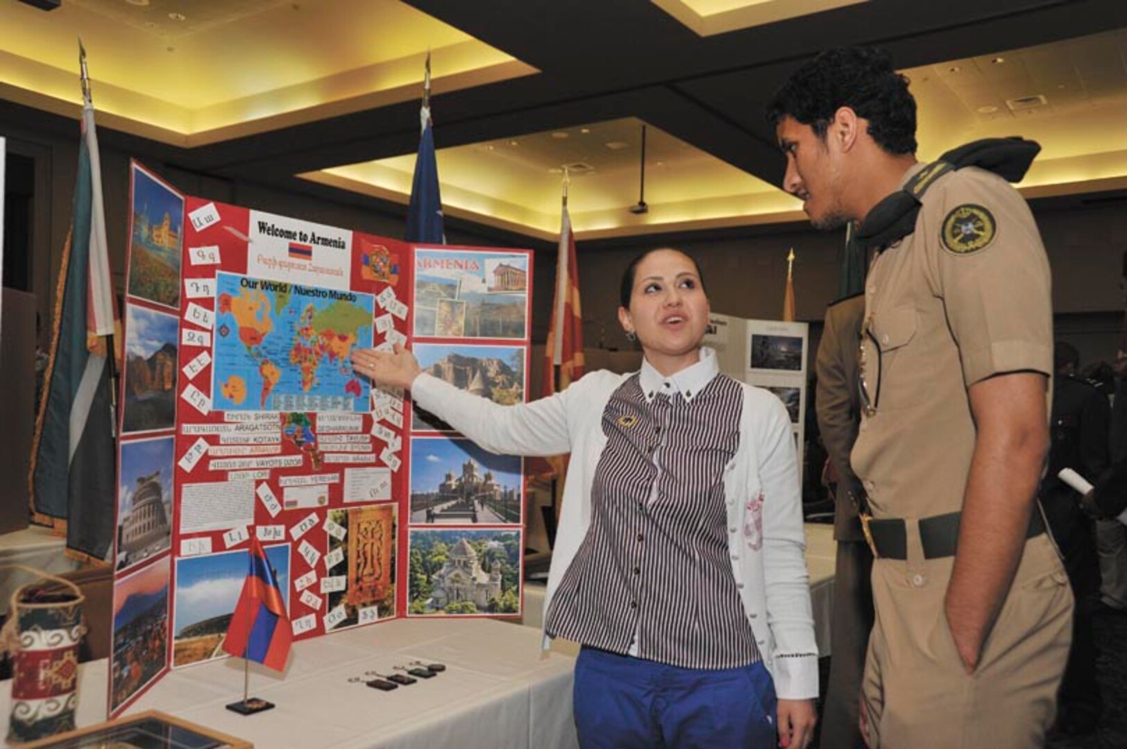 LacSusanna Sasajyan, a Basic American Language Instructor Course student proudly describes her home country of Armenia to Saudi air force Second Lieutenant Abdulaziz Almalki.  (Photo by Alan Boedeker)