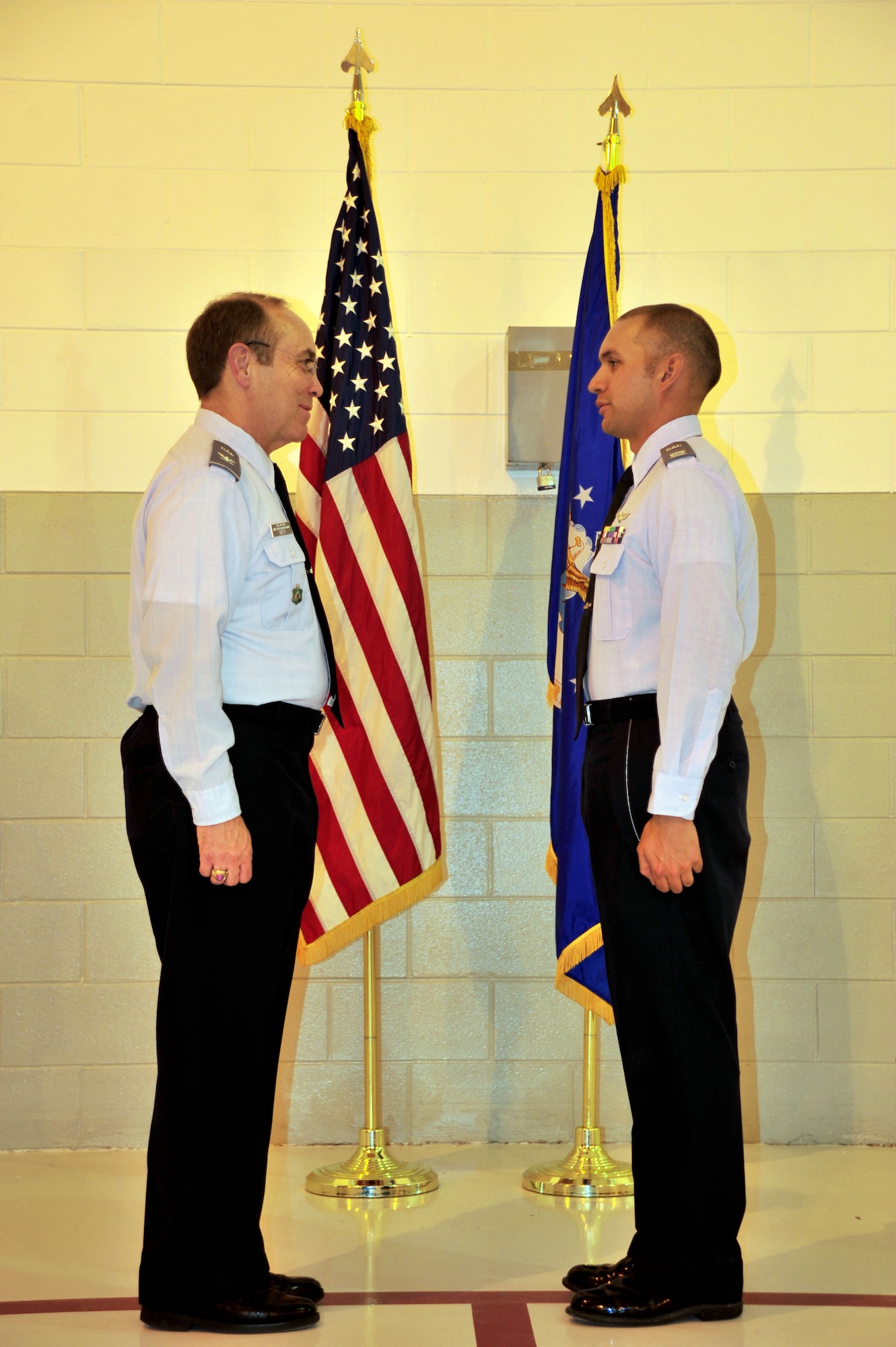 Civil Air Patrol Col. Mark Smith, New Mexico Wing CAP commander, relieves 1st Lt. David O’Leary of command of the CAP Clovis High Plains Composite Squadron, passing the title to CAP Capt. Armando Carrion, May 28, 2013. In addition to serving in the CAP organization, which was established as the official auxiliary of the U.S. Air Force in 1948, Carrion also serves as a master sergeant with the 43rd Intelligence Squadron at Cannon Air Force Base, N.M. (U.S. Air Force photo/Senior Airman Whitney Tucker)