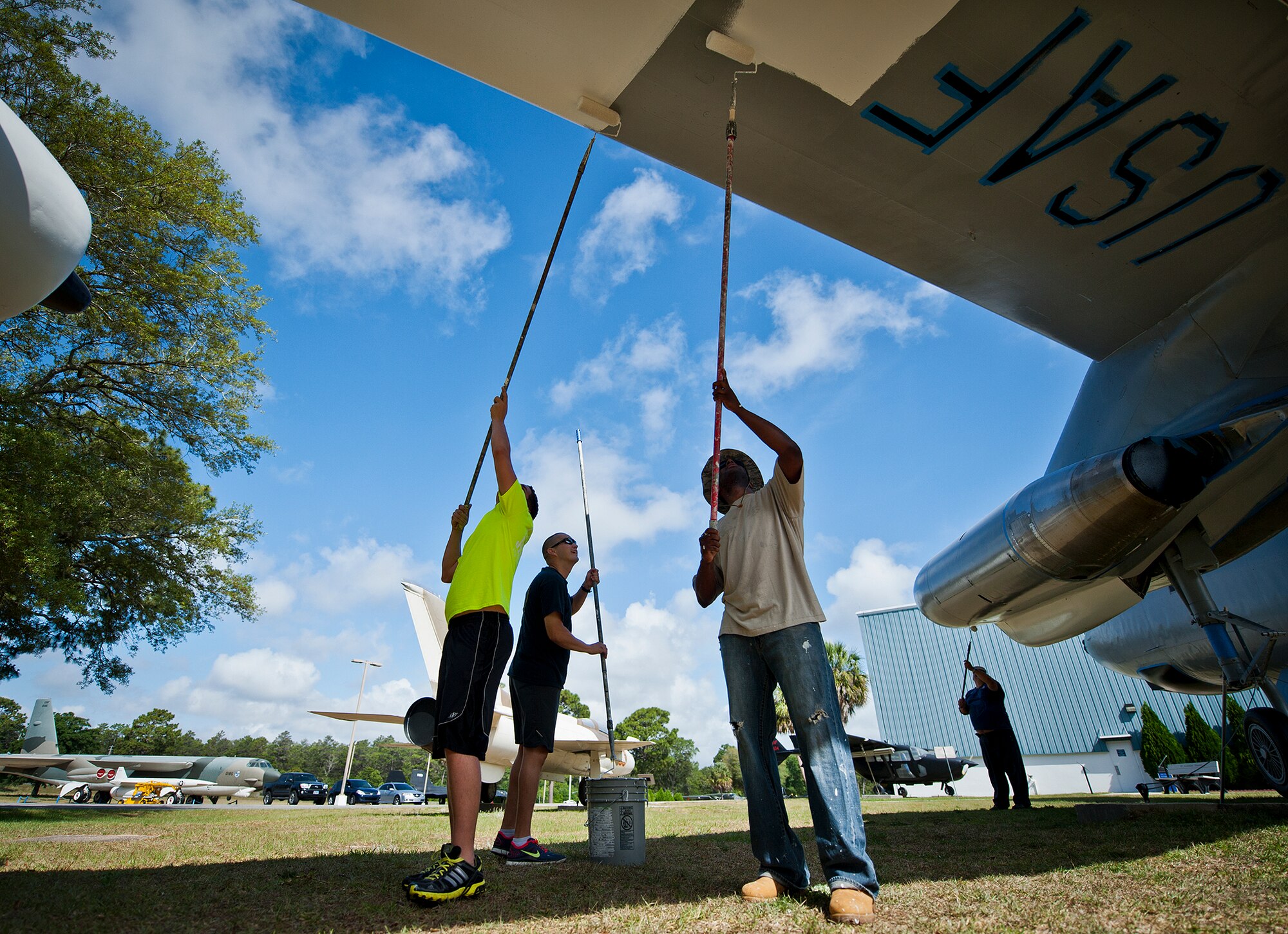 Members of the 96th Logistics Readiness Squadron paint the bottom of the wing of a B-47 aircraft display at the Air Force Armament Museum, May 25.  Members of LRS’s petroleum, oil and lubricants flight work to restore the B-47 as part of Eglin’s Adopt-a-Plane program.  It has been almost 13 years since the B-47 was renovated.  The newly restored aircraft is scheduled to be completed in July. (U.S. Air Force photo/Samuel King Jr.)