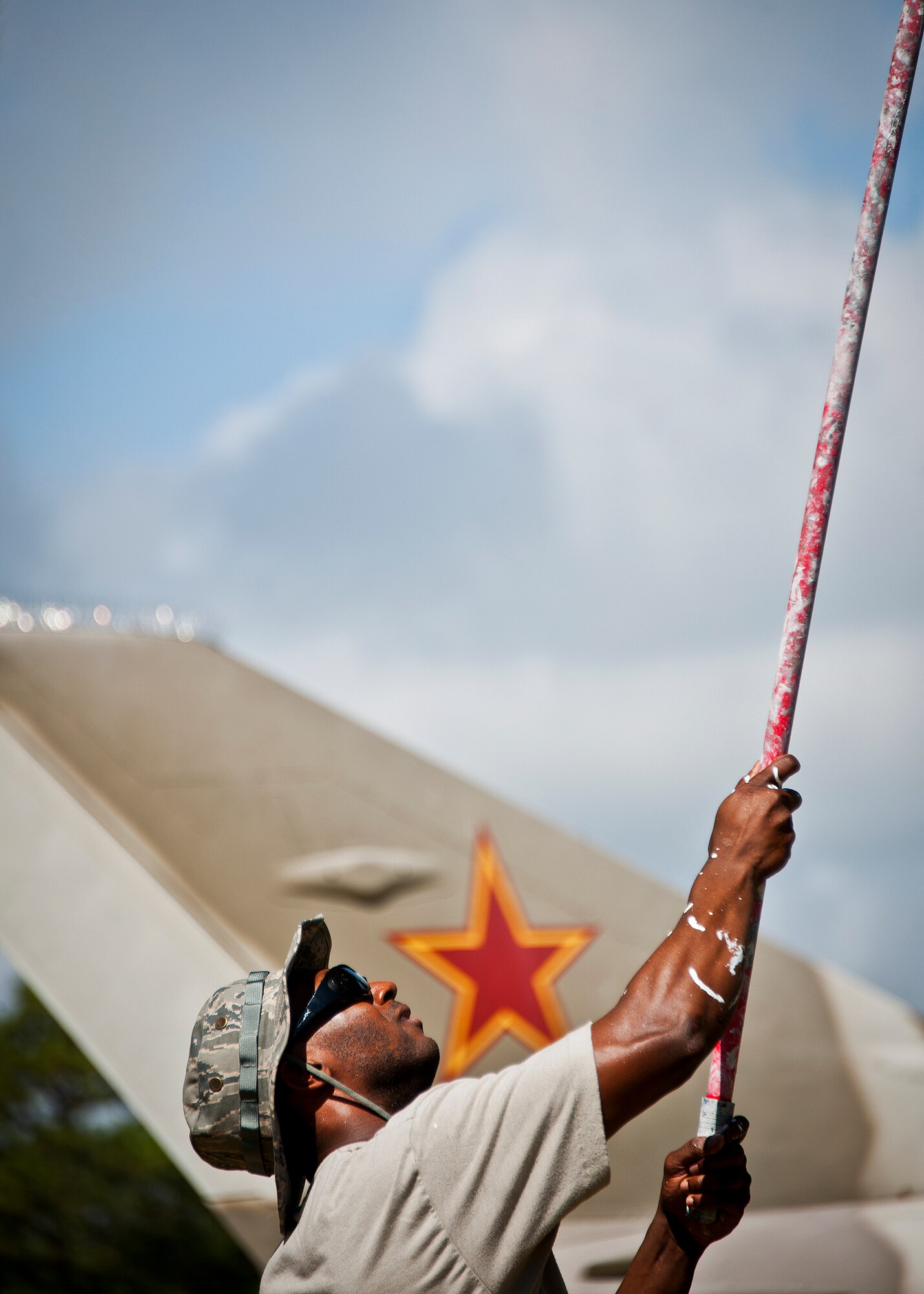 Tech. Sgt. Lee Gore, of the 96th Logistics Readiness Squadron, paints the underside of a B-47 aircraft display at the Air Force Armament Museum, May 25. Gore and other members of LRS’s petroleum, oil and lubricants flight work to restore the B-47 as part of Eglin’s Adopt-a-Plane program.  It has been almost 13 years since the B-47 was renovated.  The newly restored aircraft is scheduled to be completed in July. (U.S. Air Force photo/Samuel King Jr.)