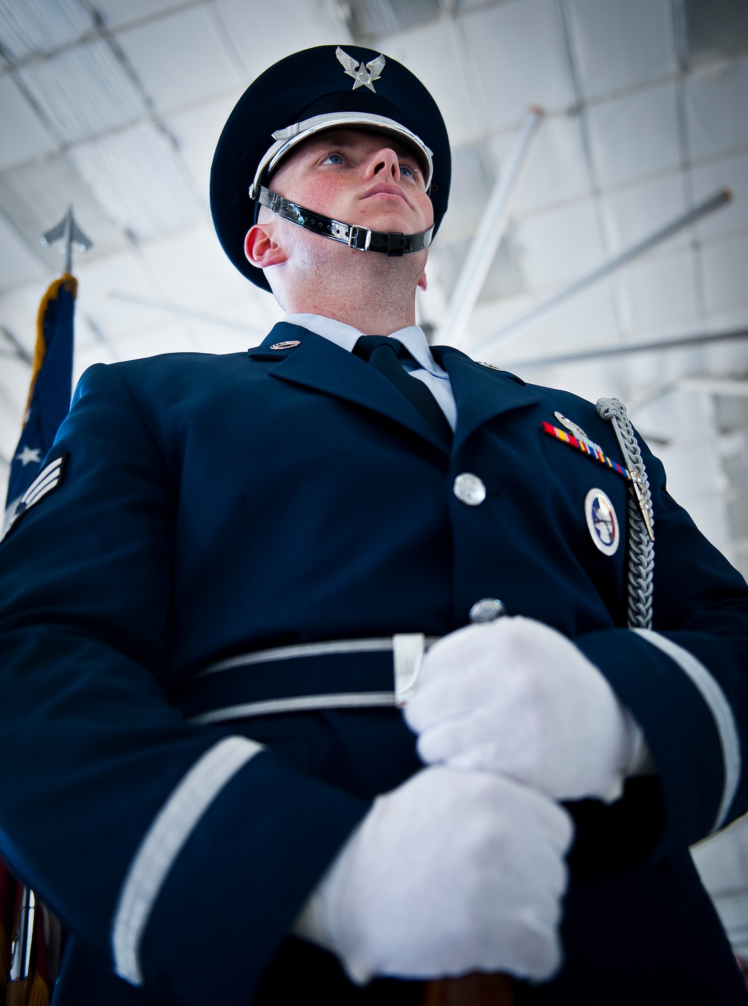 Senior Airman Arlo Brownlee stands ready to lead in the Eglin Honor Guard at the 53rd Wing change of command ceremony May 30 at Eglin Air Force Base, Fla.  Col. Alexus Grynkewich took command of the wing from Col. David Hicks, who leaves to become the deputy director of operations for North American Aerospace Defense Command at Peterson, AFB, Colo.  (U.S. Air Force photo/Samuel King Jr.)