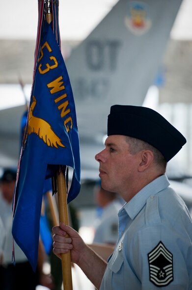 Chief Master Sgt. Charles Littleton, of the 53rd Electronic Warfare Group, holds the group’s guidon prior to the 53rd Wing change of command ceremony May 30 at Eglin Air Force Base, Fla.  Col. Alexus Grynkewich took command of the wing from Col. David Hicks, who leaves to become the deputy director of operations for North American Aerospace Defense Command at Peterson, AFB, Colo.  (U.S. Air Force photo/Samuel King Jr.)