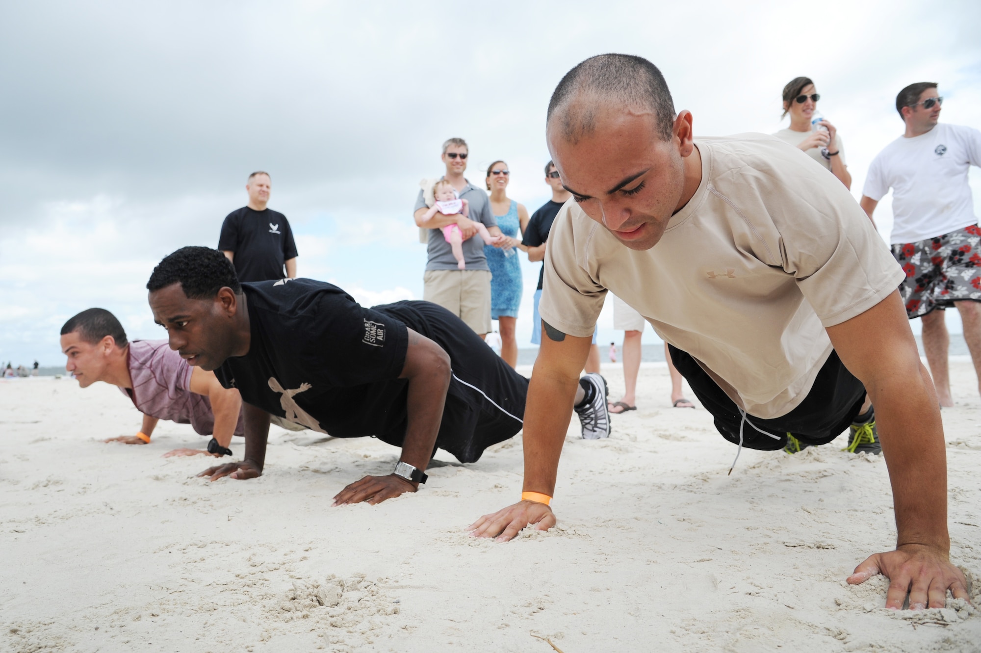 : Christian Lopez, 927th Development Training Flight recruit, competes in a push-up competition at the 927th Air Refueling Wing's Family Day at MacDill Air Force Base, May 4. The annual event for the Air Force Reserve wing allows reservists, their family members and friends to gather together and participate in a variety of morale activities, including such events as raffles, a sporting competition and a car show. (Official U.S. Air Force photo/Staff Sgt. Jennie Chamberlin)