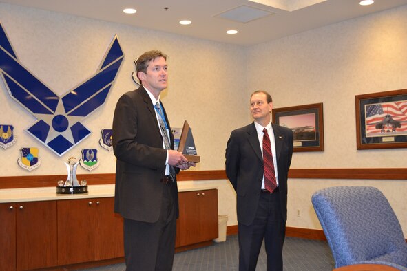 The Oklahoma City Air Logistics Complex received a big award May 22. Kevin O’Connor, OC-ALC vice director, left, accepted the 2012 Air Force Materiel Command Maintenance Effectiveness Award for Depot Maintenance from Ross Marshall, Air Force Sustainment Center executive director, during a brief ceremony in the Anaconda Room. (Air Force photo by Brandice J. O’Brien)