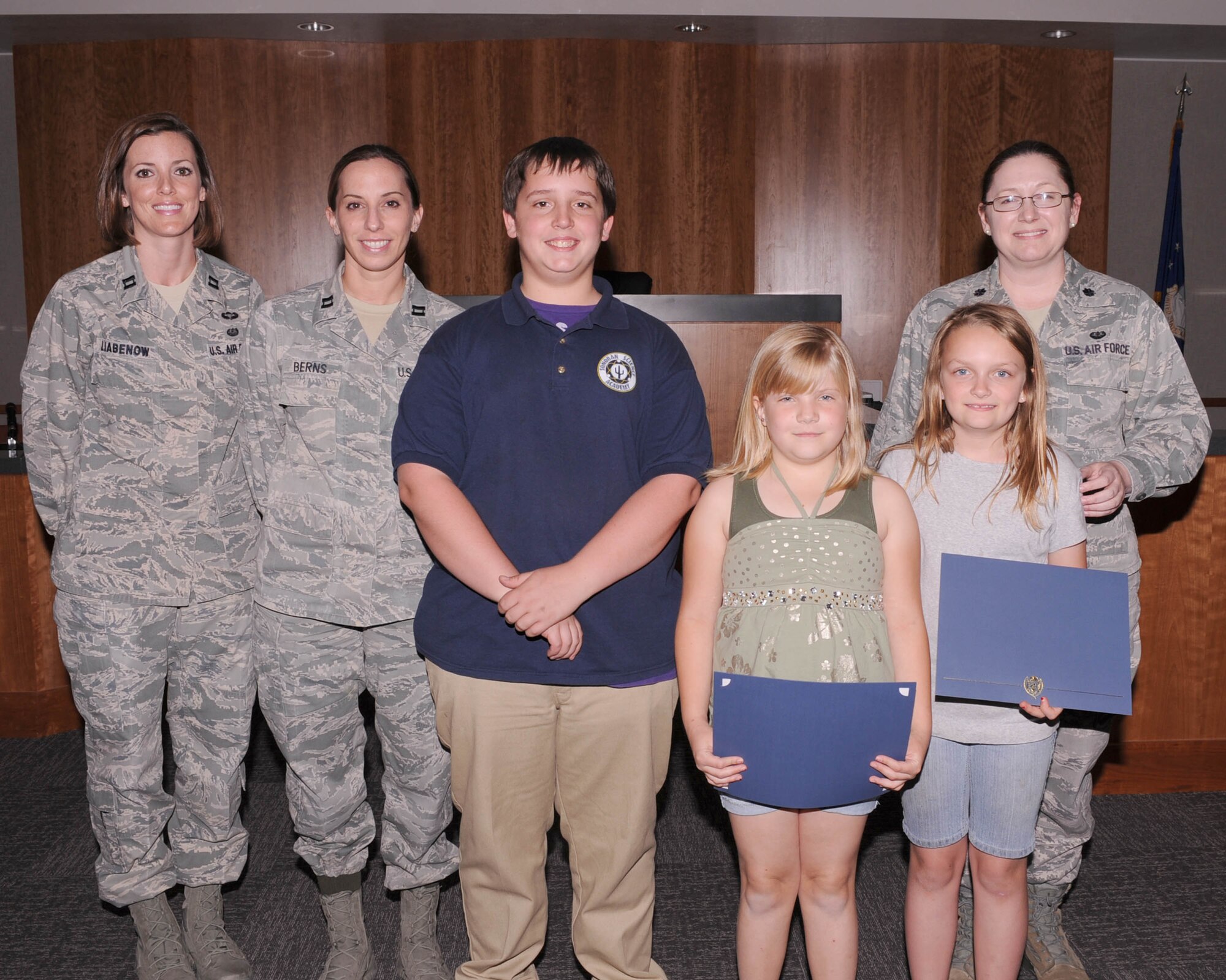 U.S. Air Force members from the 355th Fighter Wing legal office presented students who had participated in the Law Day competition awards at Davis-Monthan Air Force Base, Ariz.,May 10, 2013. Law Day is celebrated every year May 1, a day first declared by Congress in 1961 as a day to celebrate the rule of law. (U.S. Air Force photo by Airman 1st Class Christine Griffiths/Released)